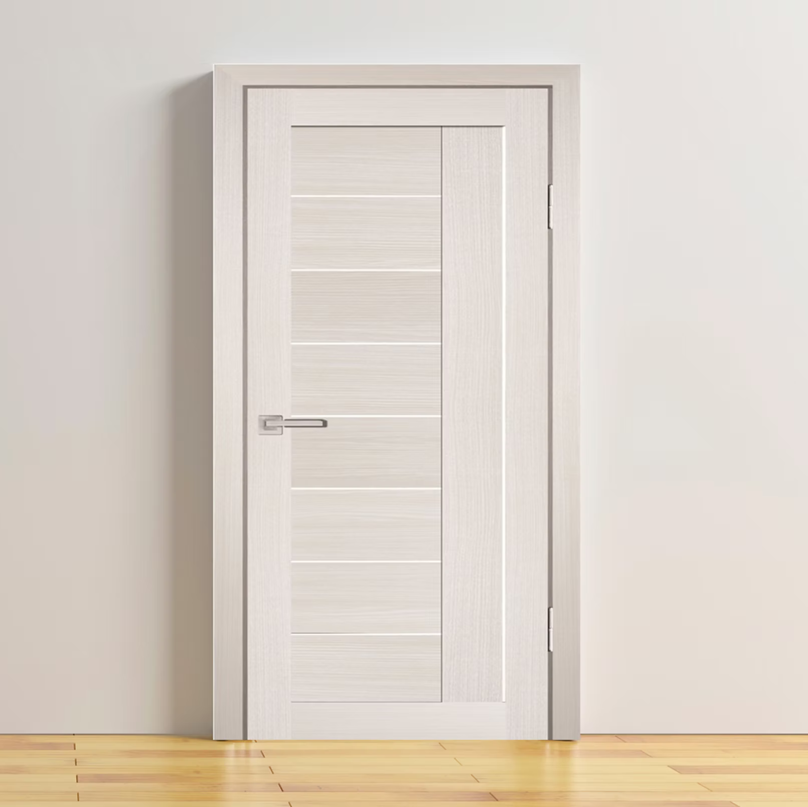 White door with silver handle on a plain white wall with wooden floor